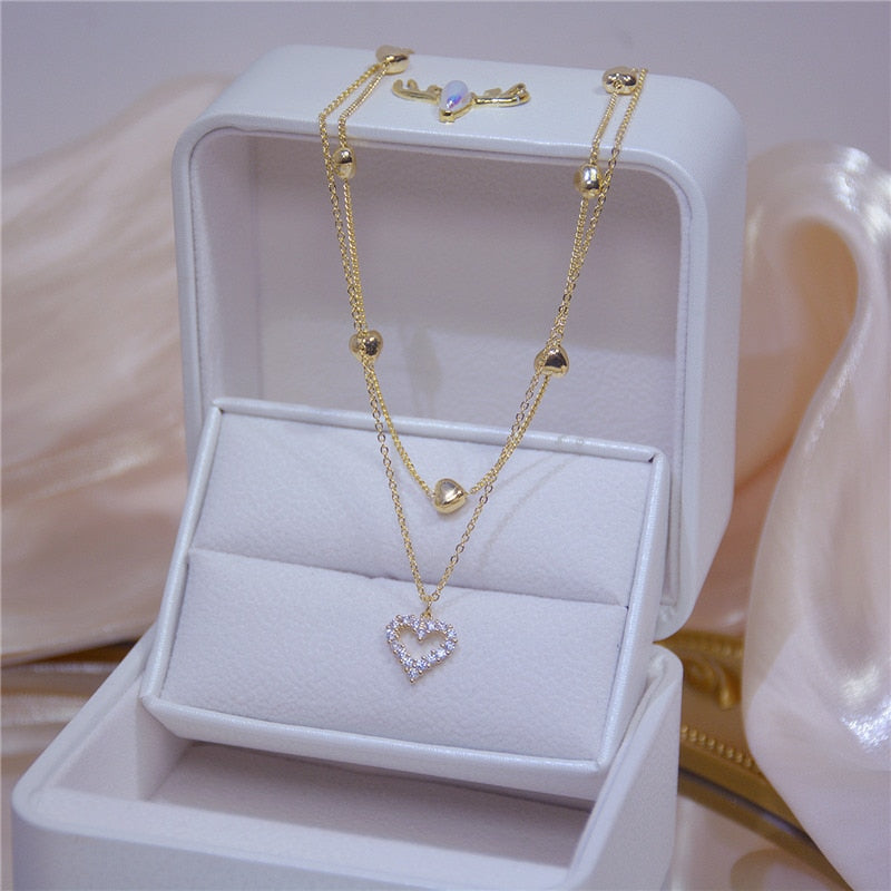 Colar Duplo Dourado com Coração Cravejado de Zircônias | BELLORIE
